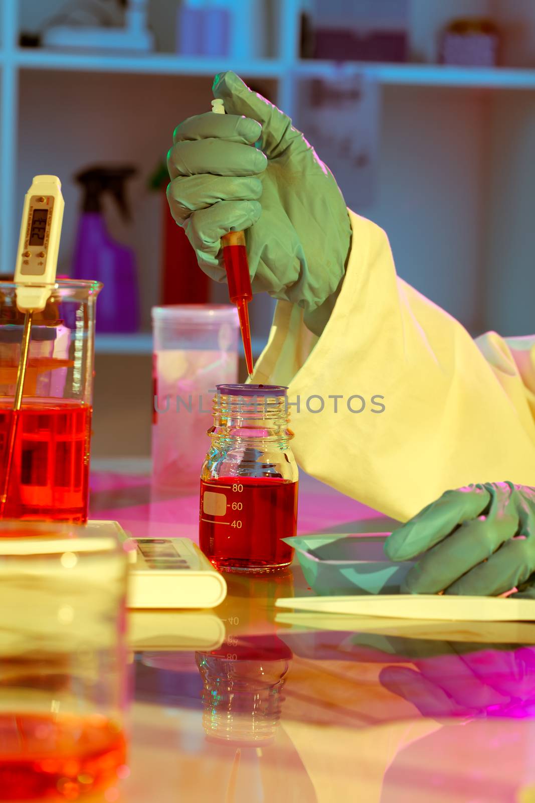 researchers work in modern scientific lab. Preparation of hazard by motorolka