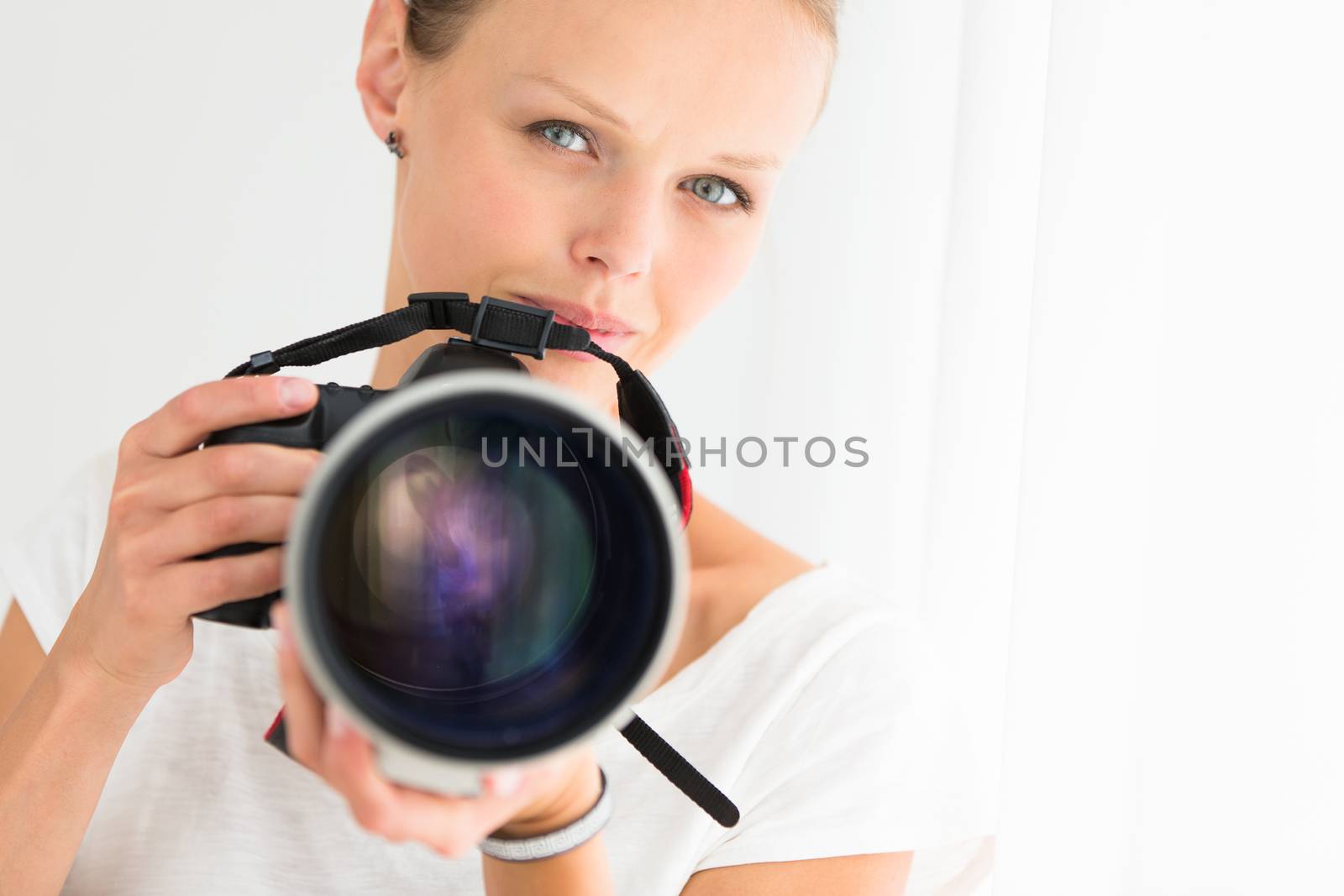 Pretty, female photographer with digital camera by viktor_cap
