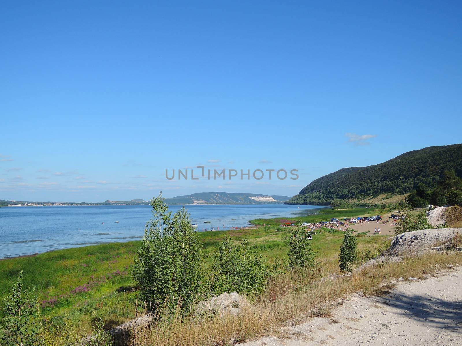 beach on the banks of the Volga with mountain summer day  by butenkow