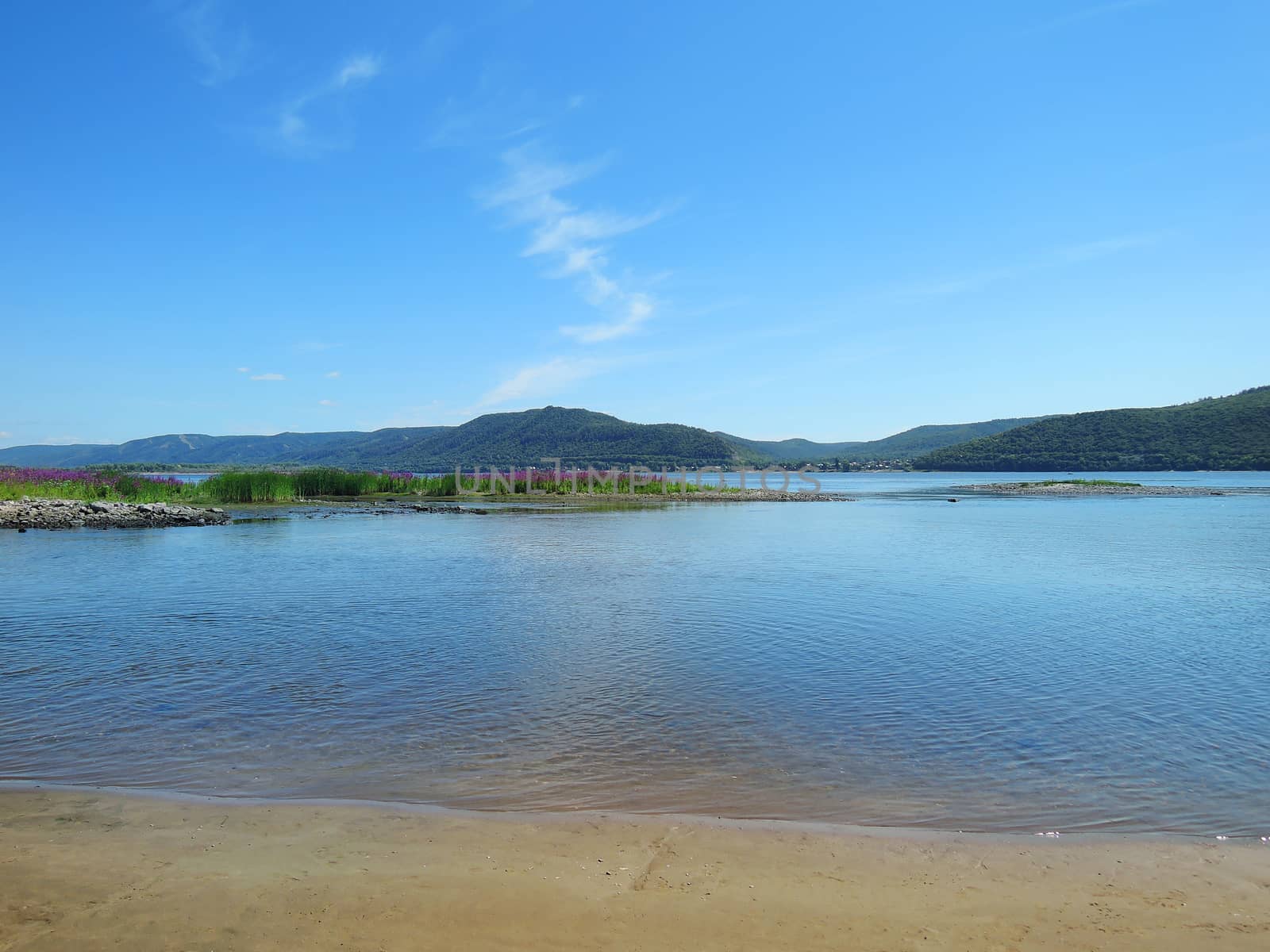 sandy beach overlooking the Volga Zhiguli Mountains  by butenkow