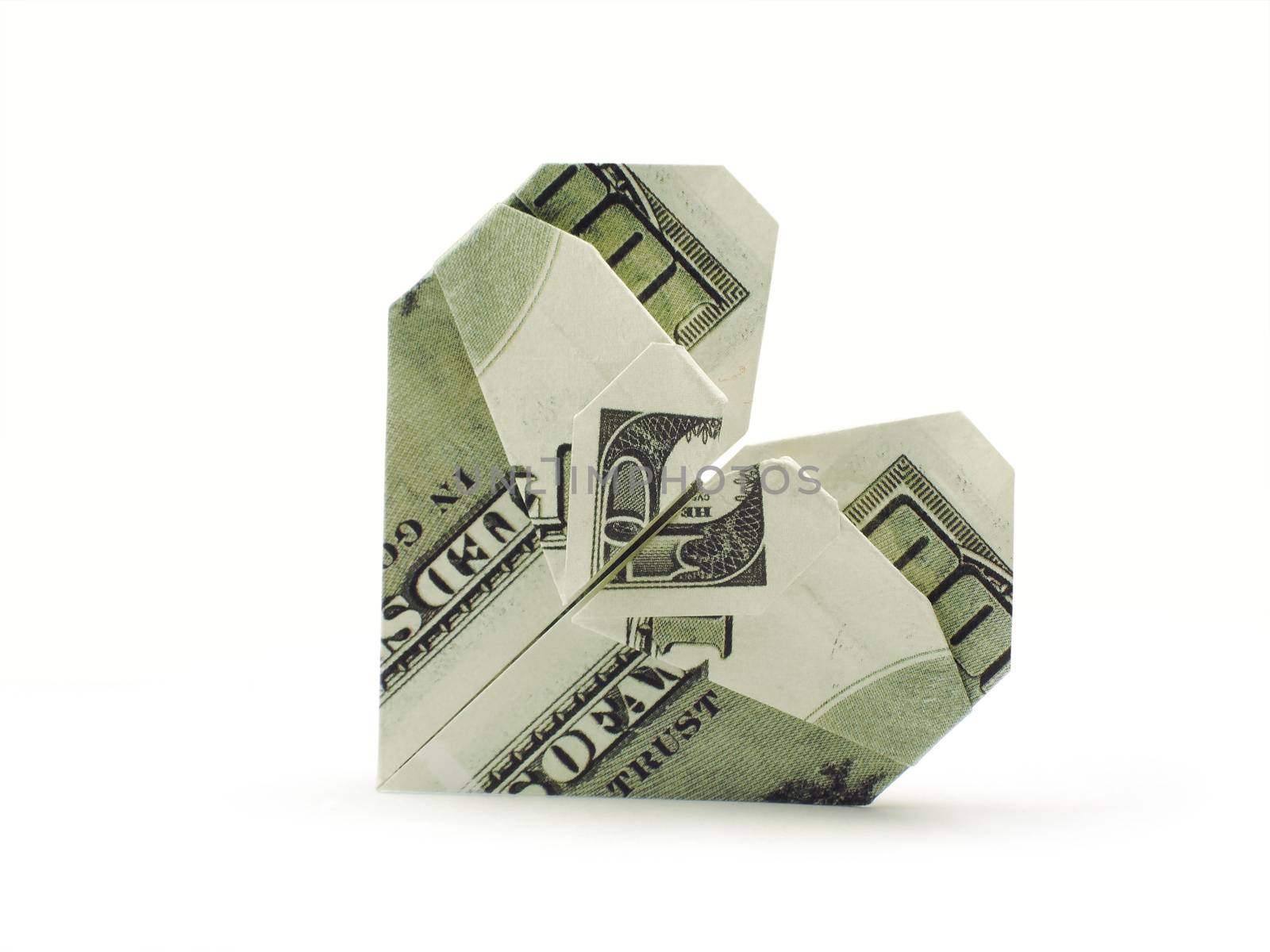 origami heart of hundred dollar banknotes by butenkow