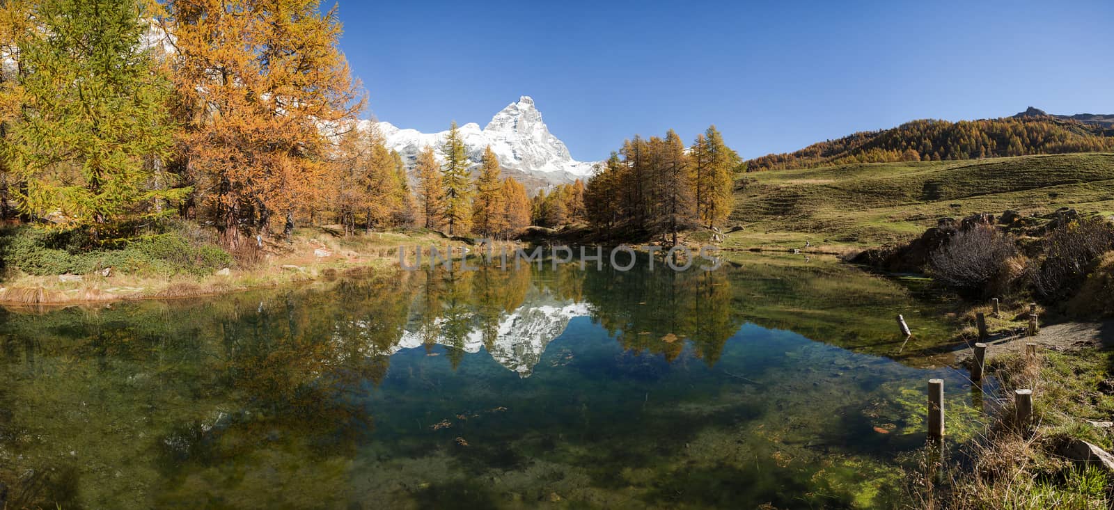 Matterhorn and Blue Lake in autumn sunny day, Aosta Valley