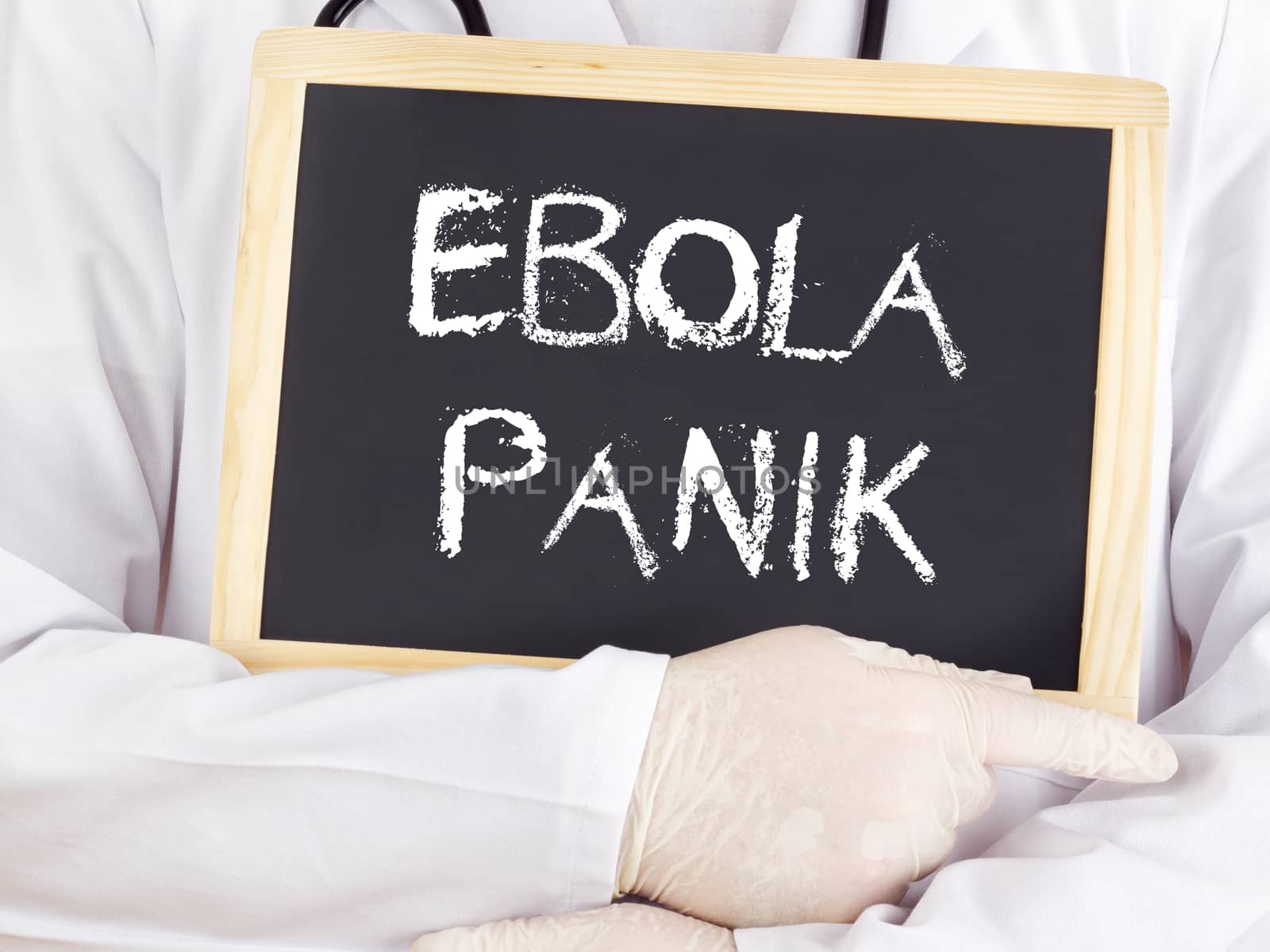 Doctor shows information: Ebola panic in german language by gwolters