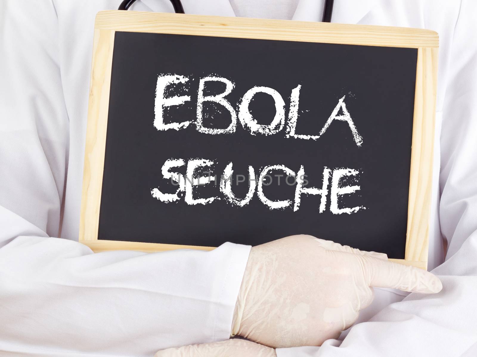 Doctor shows information: Ebola plague in german language by gwolters