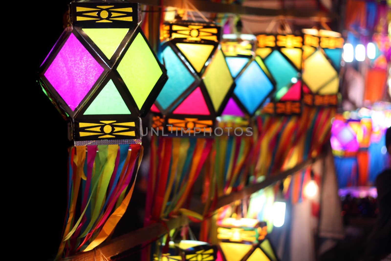 Traditionally made colorful lanterns fluttering in the winds on the Indian streetside decoration, on the occasion of Diwali festival in India