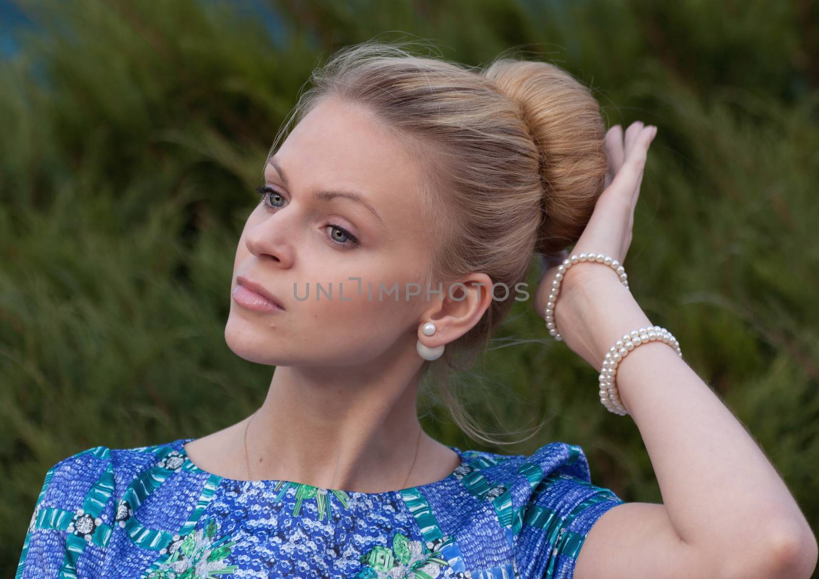 Young girl blonde on simple dark background