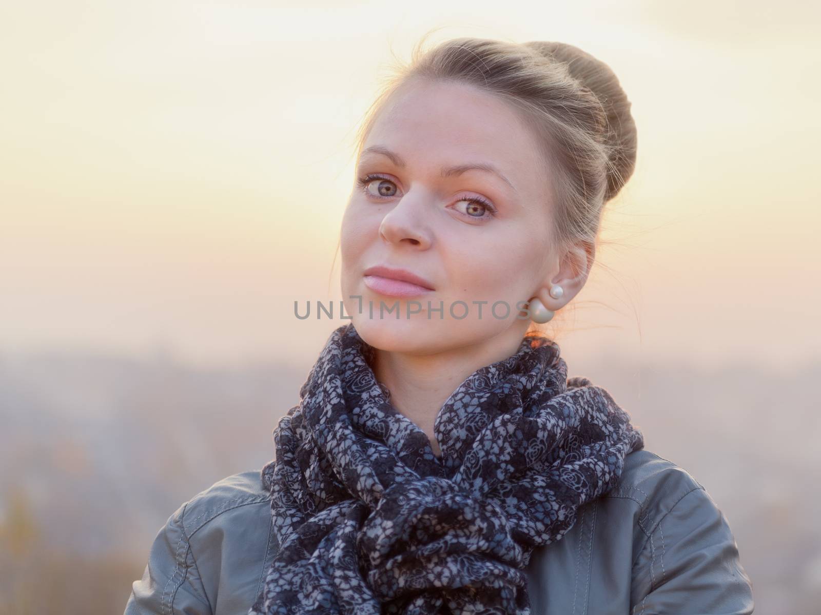 Young girl blonde on simple light background