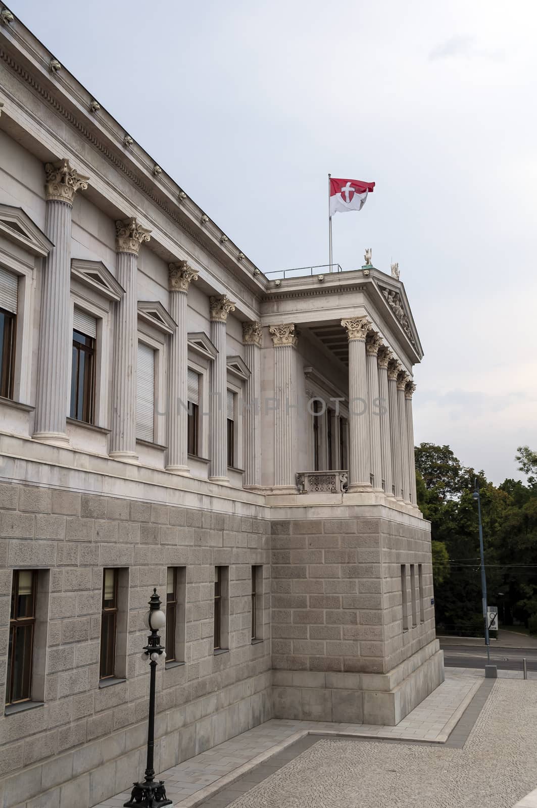 Austrian Parliament building and flag in Vienna.