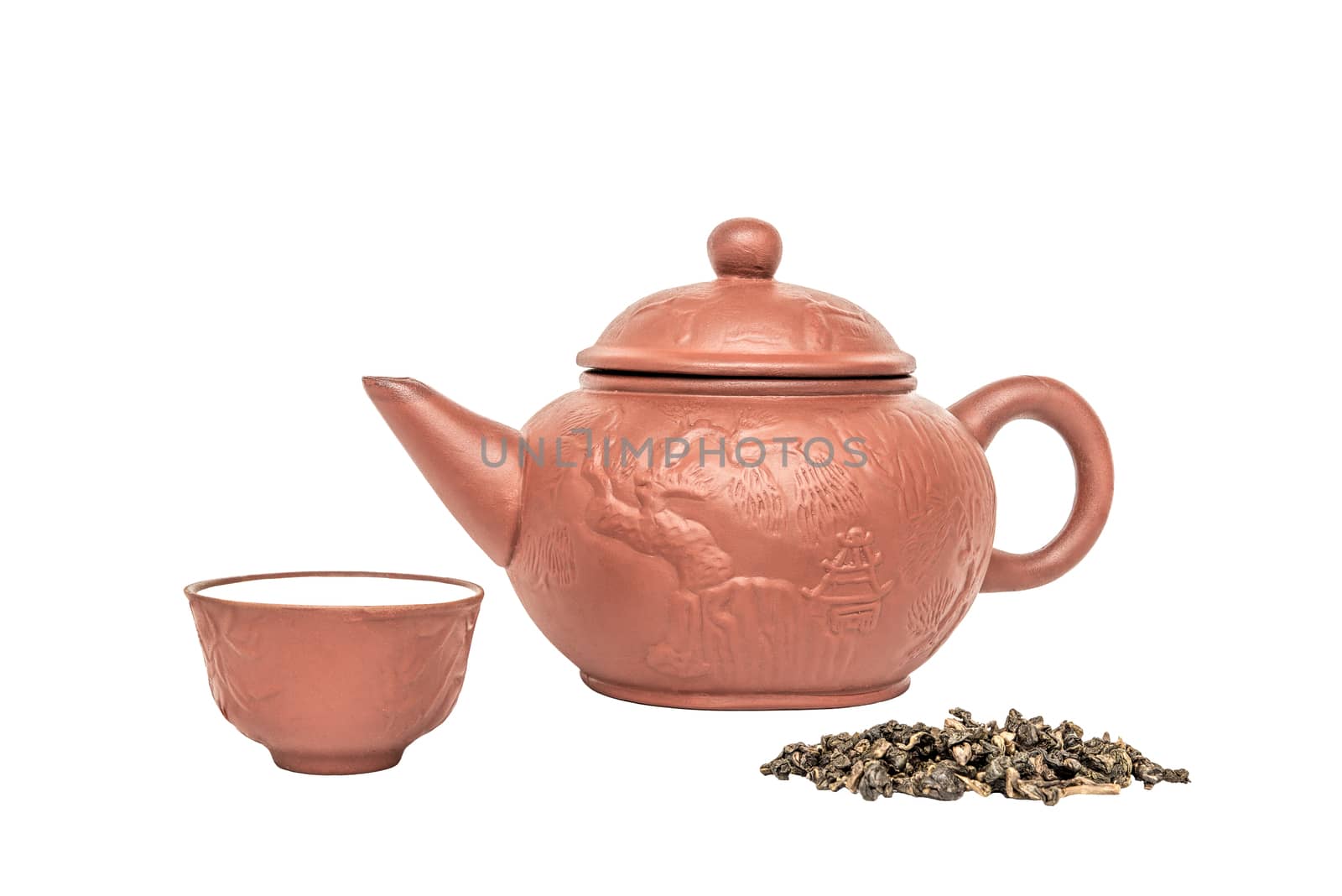 Chinese teapot, teacup, tea leaves, isolated on white background