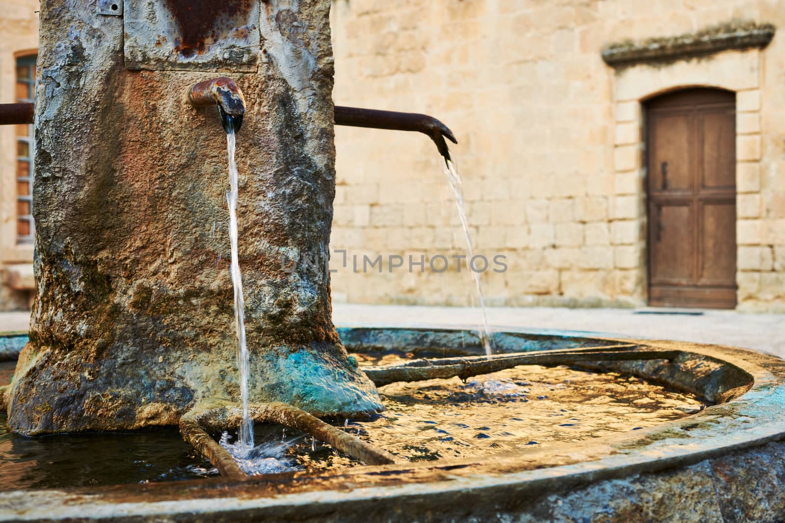 Ancient fountain in Provence by ecobo
