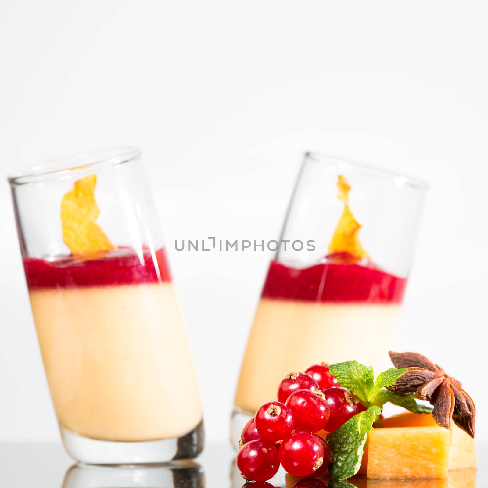 Dessert panna cotta with fresh berry on white background