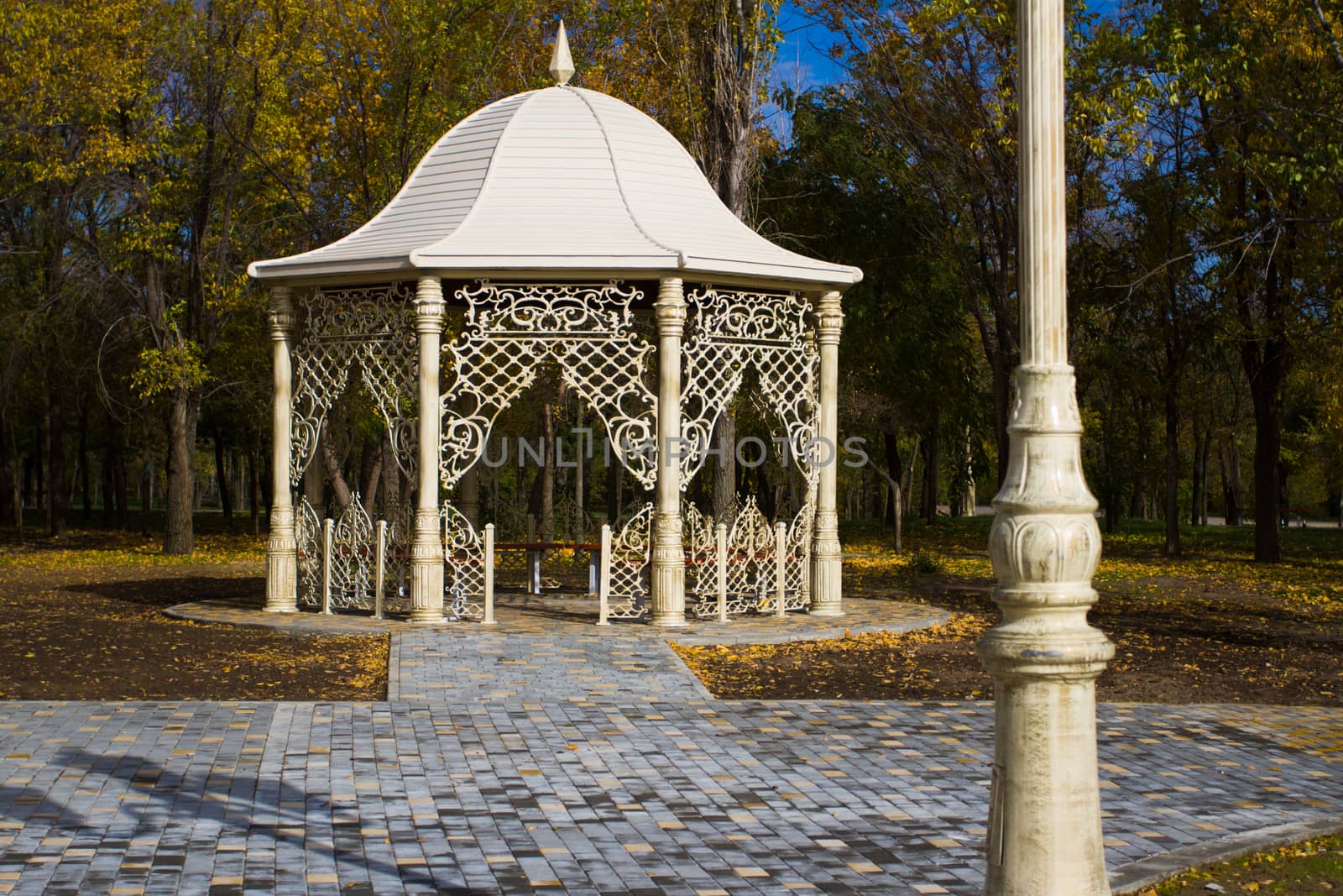 Outdoor gazebo in autumn park - Stock Image