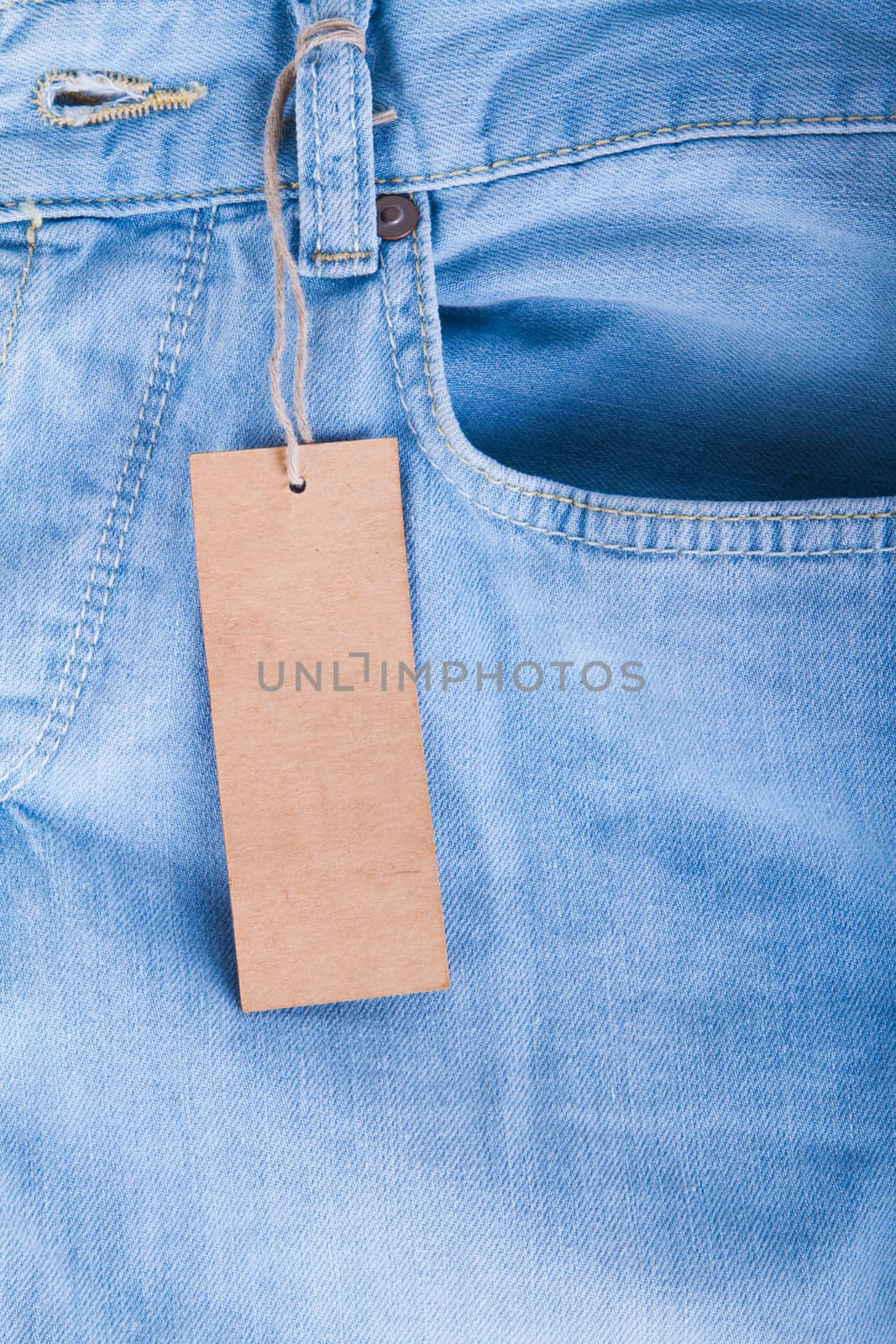 Blue jeans detail with blank label by grigorenko