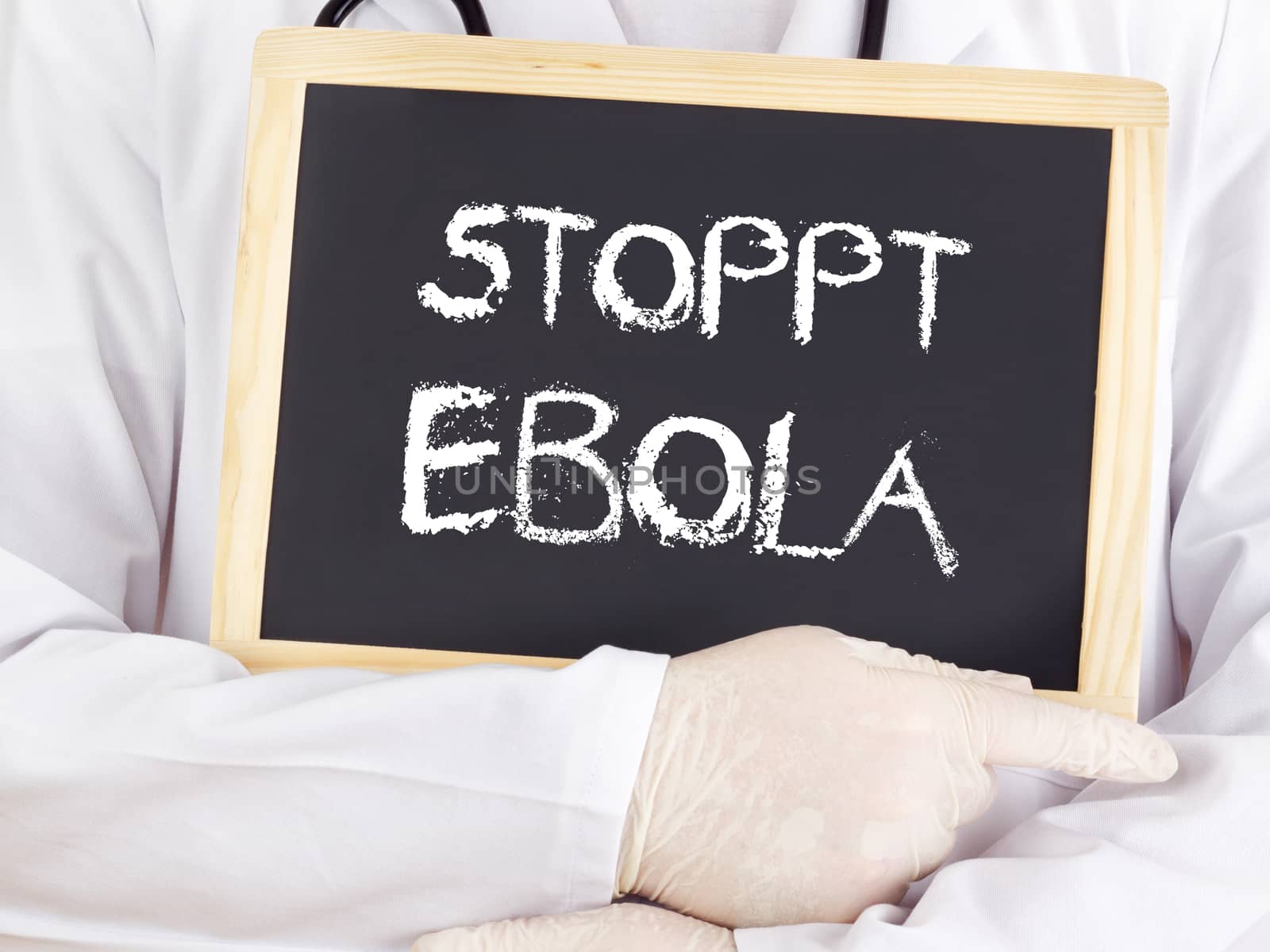 Doctor shows information: stop Ebola in german language by gwolters