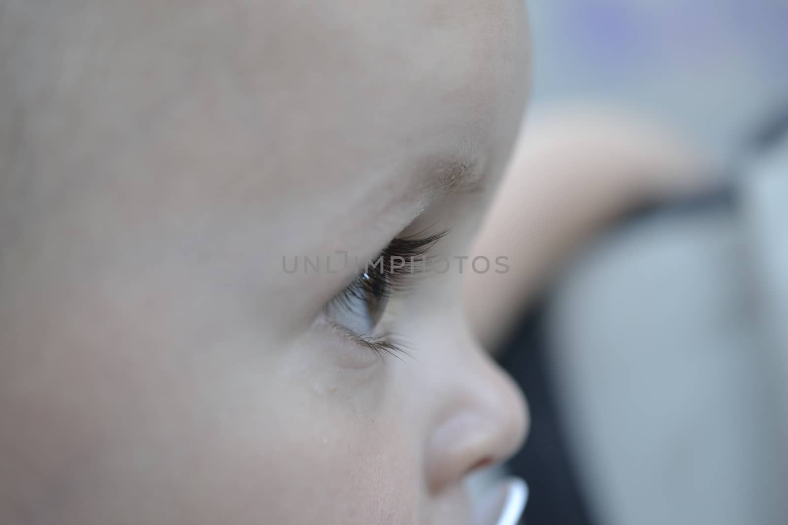 portrait of a baby from the right side. close up