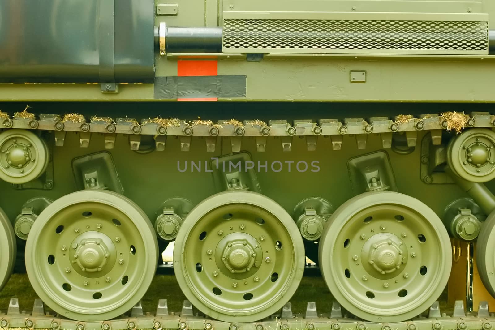 close-up of military vehicle tank tracks and wheels