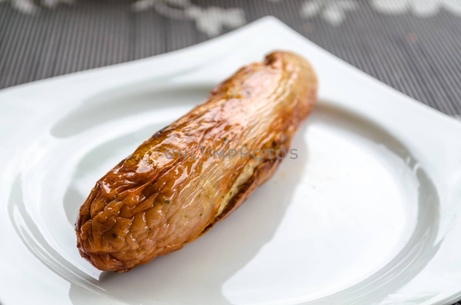 Bratwurste, BBQ sausage, sausage isolated on light plate with rolls on a light background