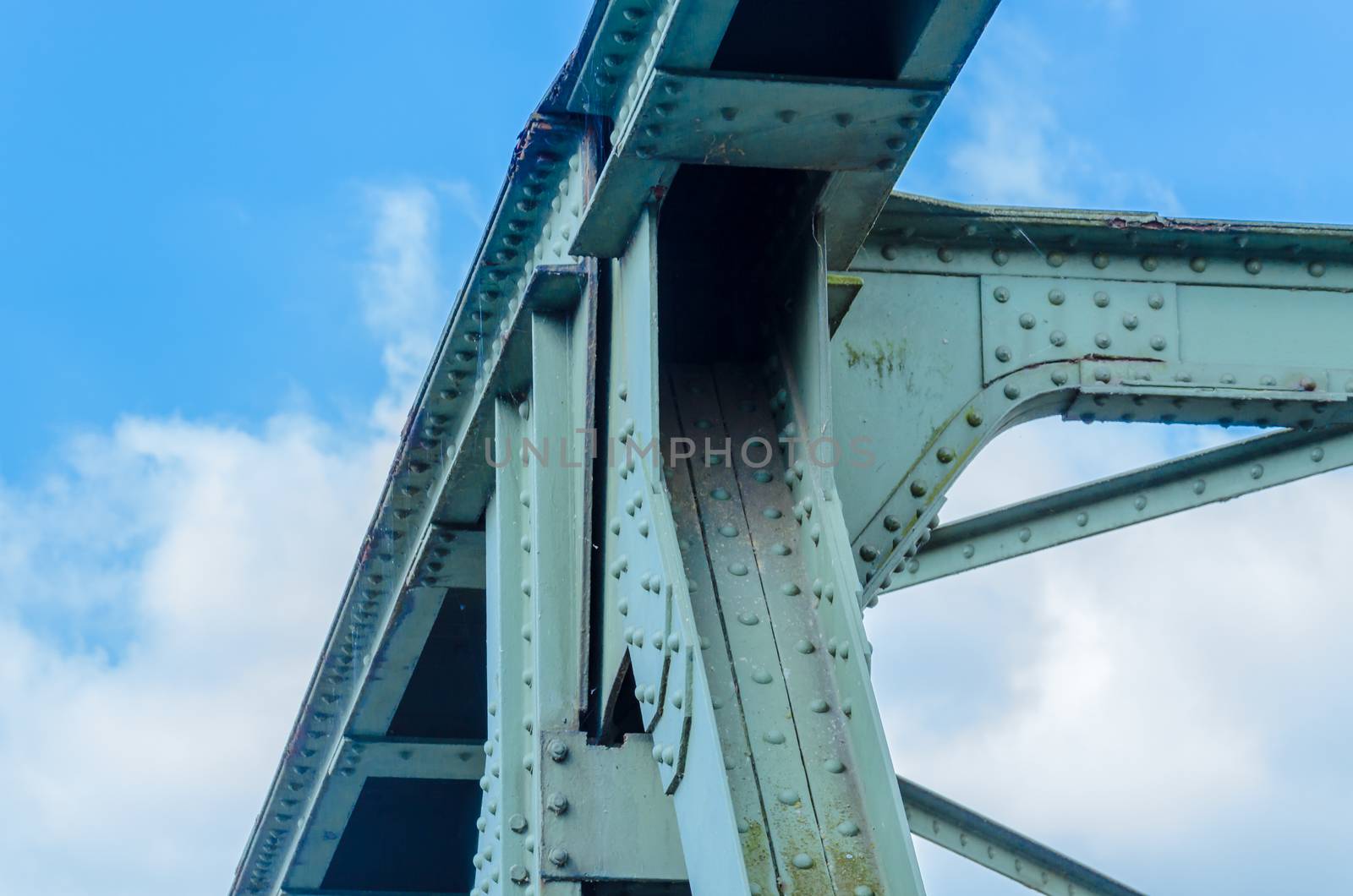 Detail view of a former old riveted railway steel bridge for pedestrians and cyclists over the Ruhr in Essen Kupferdreh