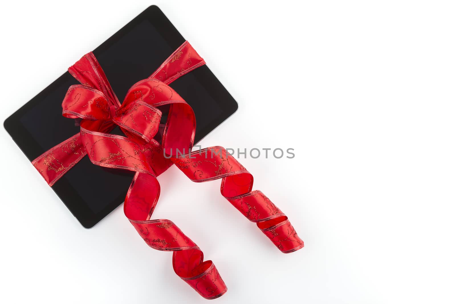 tablet pc with  christmas decorations on white by manaemedia