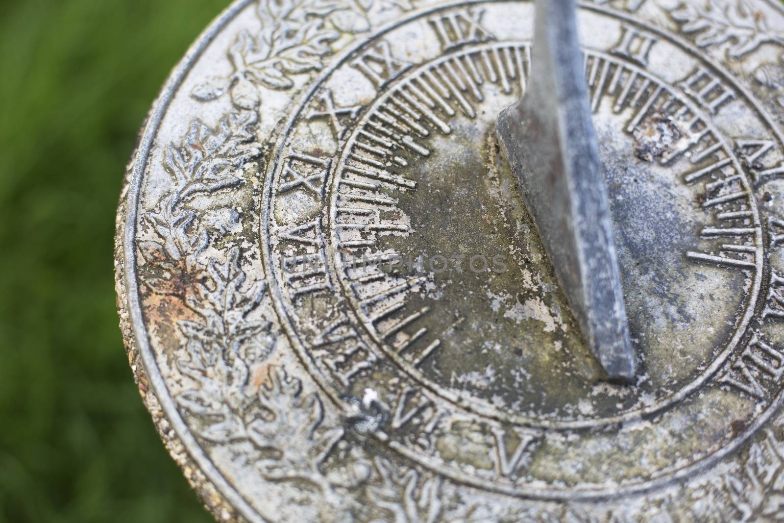 Close up of weathered  sundial in garden