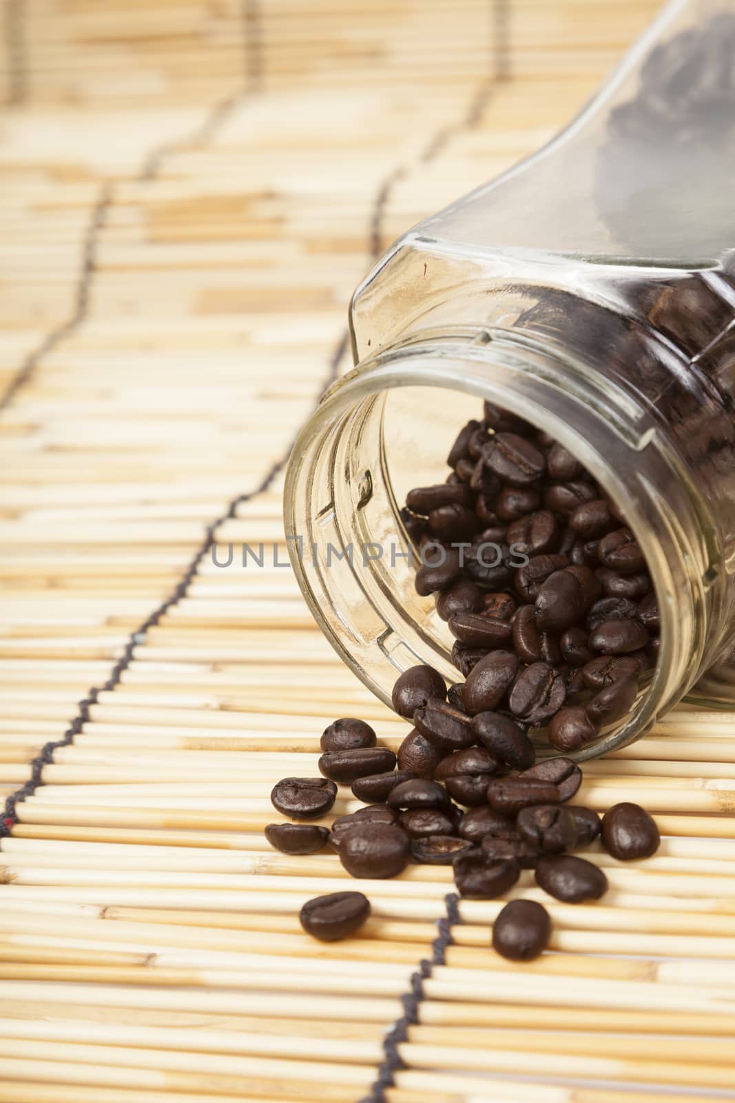 Bottle coffee beans on table wooden.bottle on table wooden.