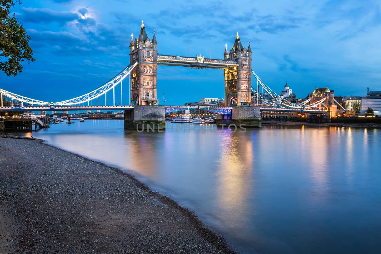 Tower Bridge and Thames River Lit by Moonlight at the Evening, London, United Kingdom