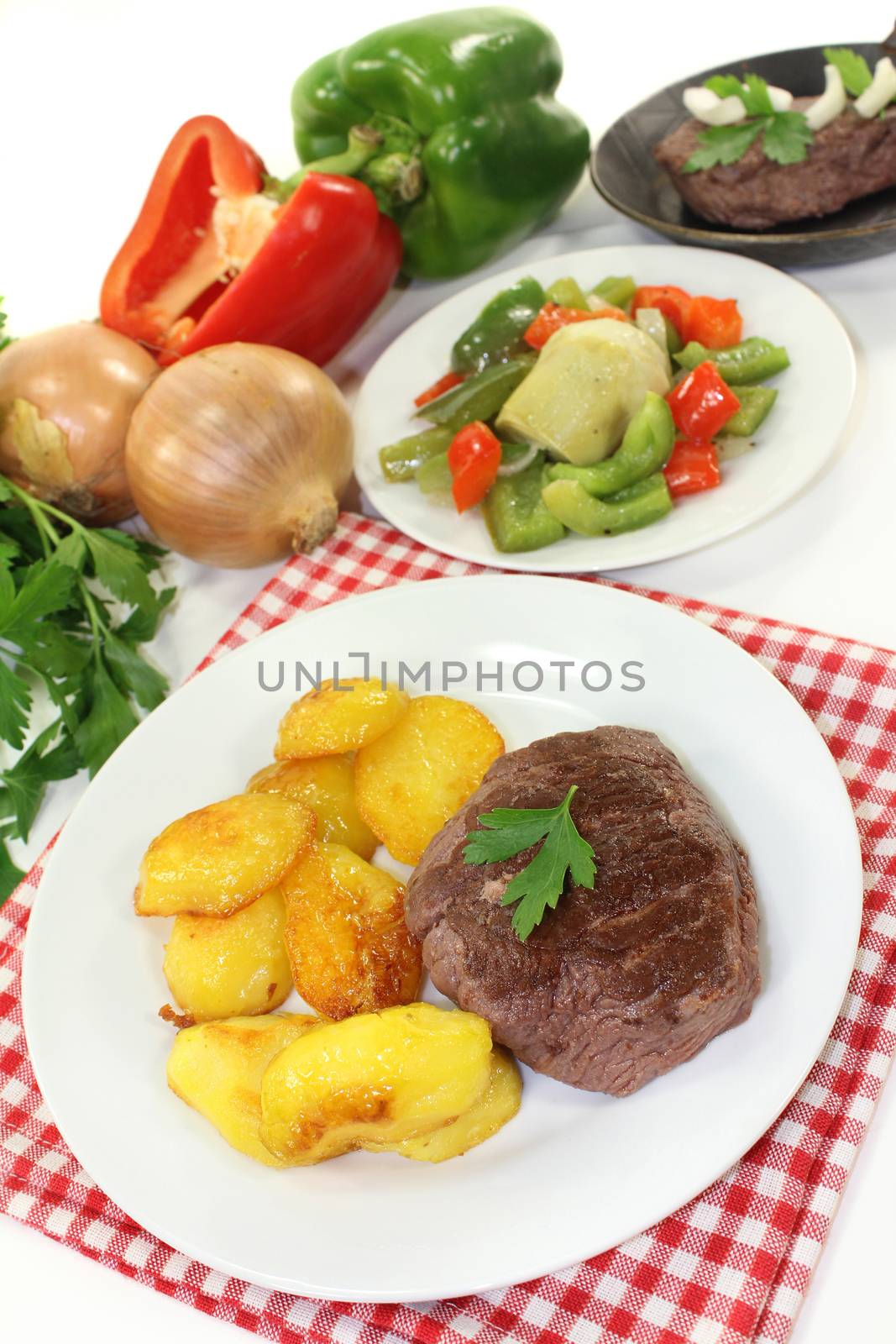 Ostrich steak with baked potatoes and peppers - artichokes - Vegetables