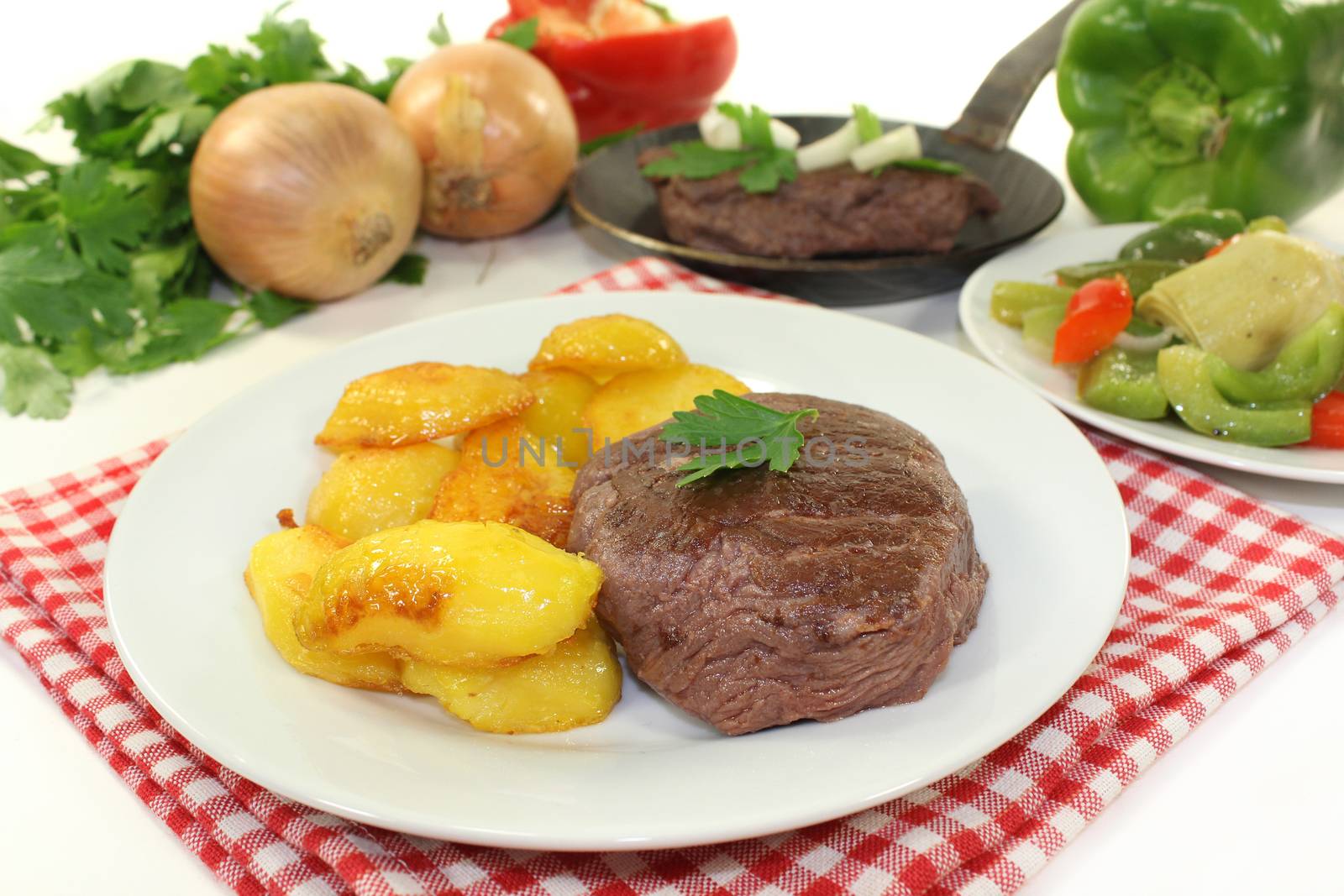 Ostrich steak with baked potatoes and peppers - artichokes - Vegetables