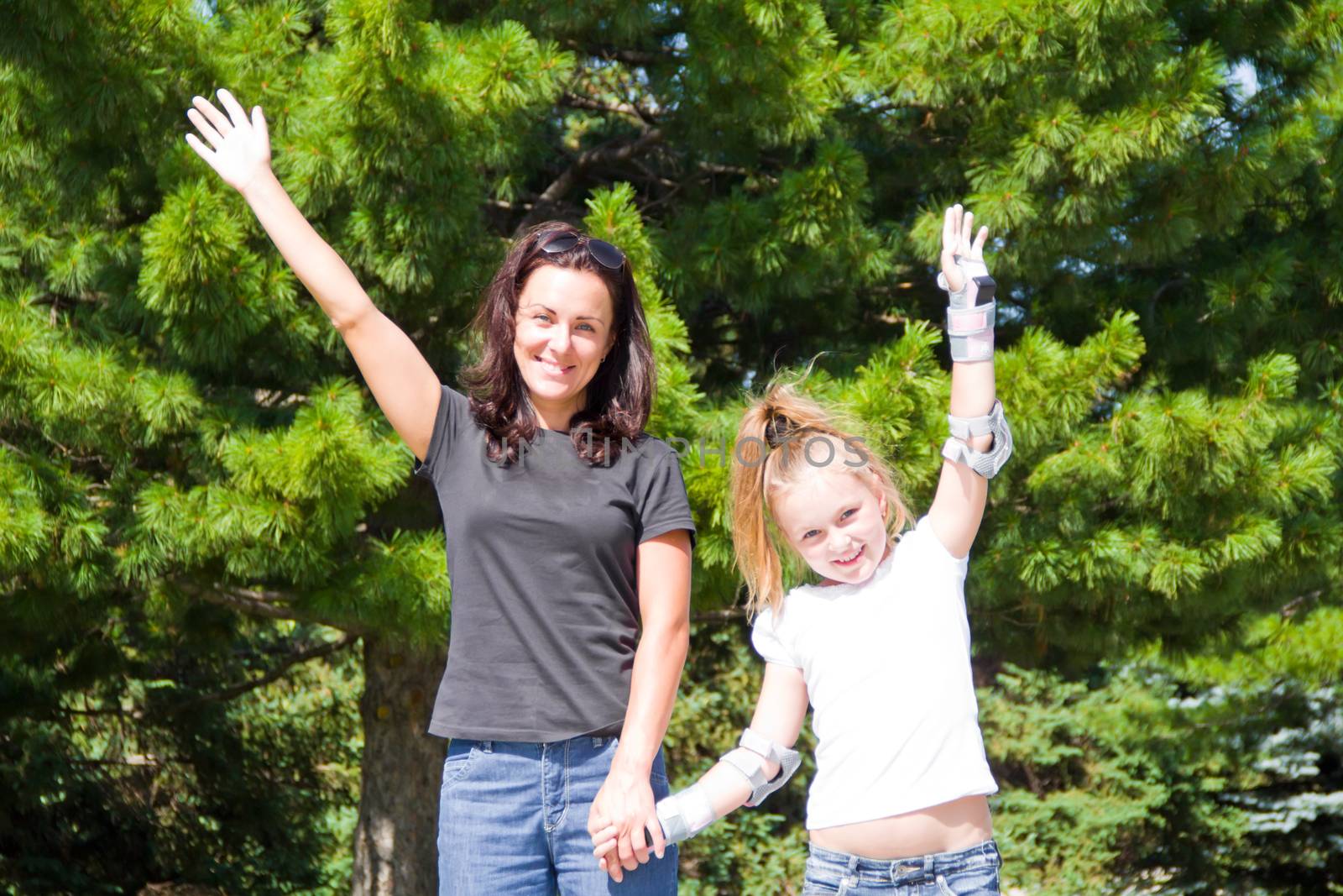 Photo of smiling mother and daughter in summer