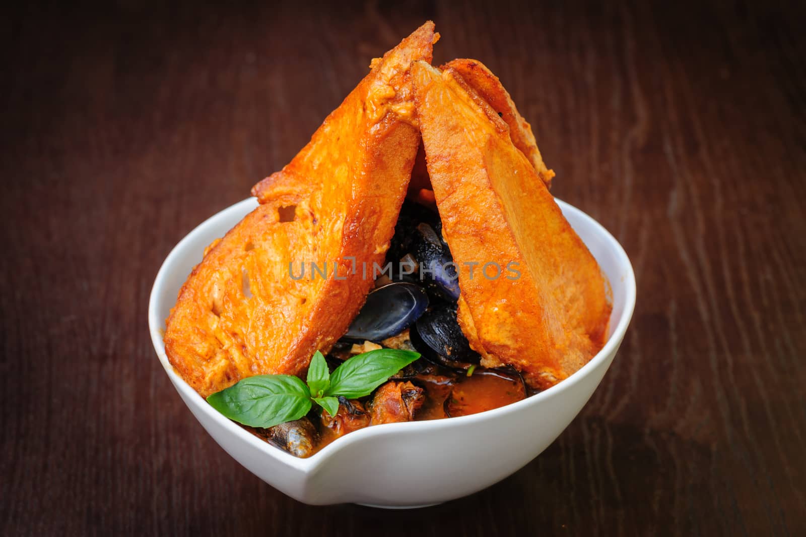 mussel and ather sea fruits soup with toasted bread