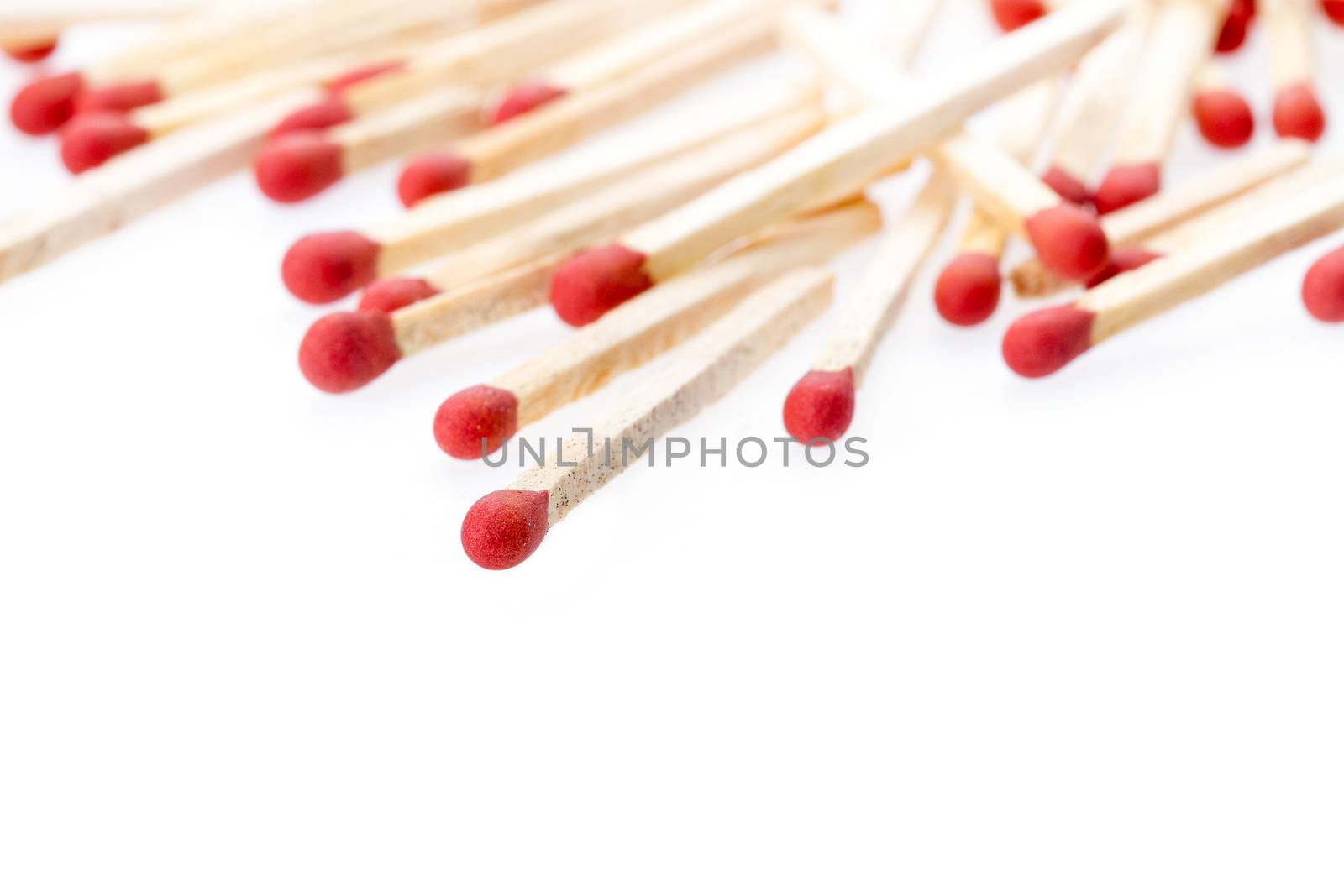 Several red matches on white background