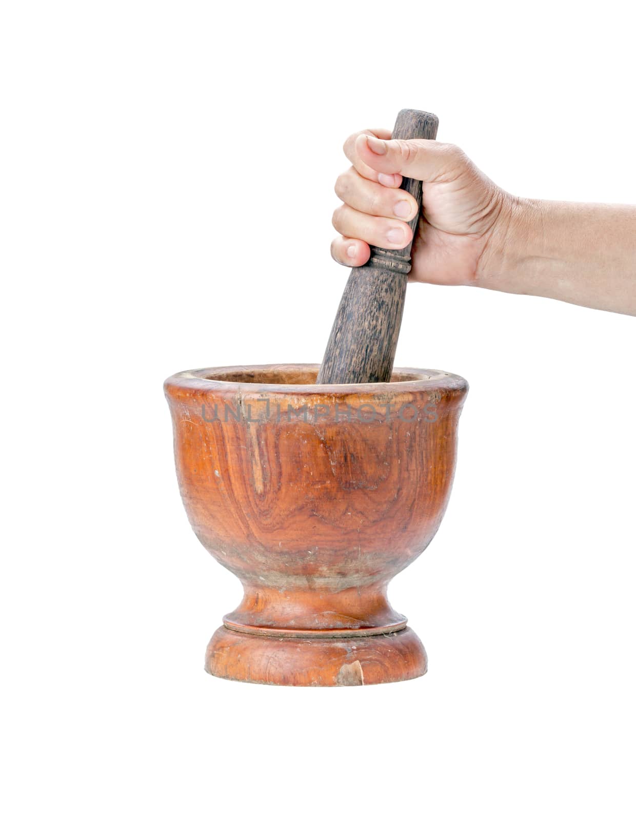 Wooden mortar and pestle on isolated white background with hand