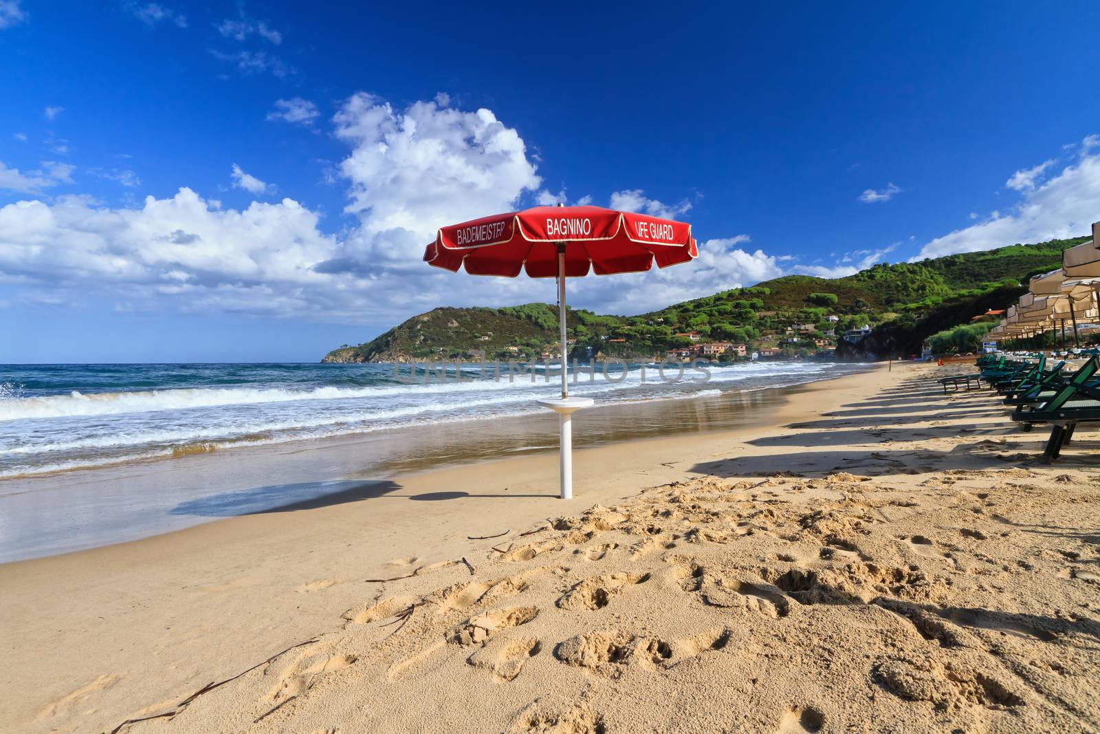 Lifeguard's umbrella on the Biodola beach, Elba Island, Italy