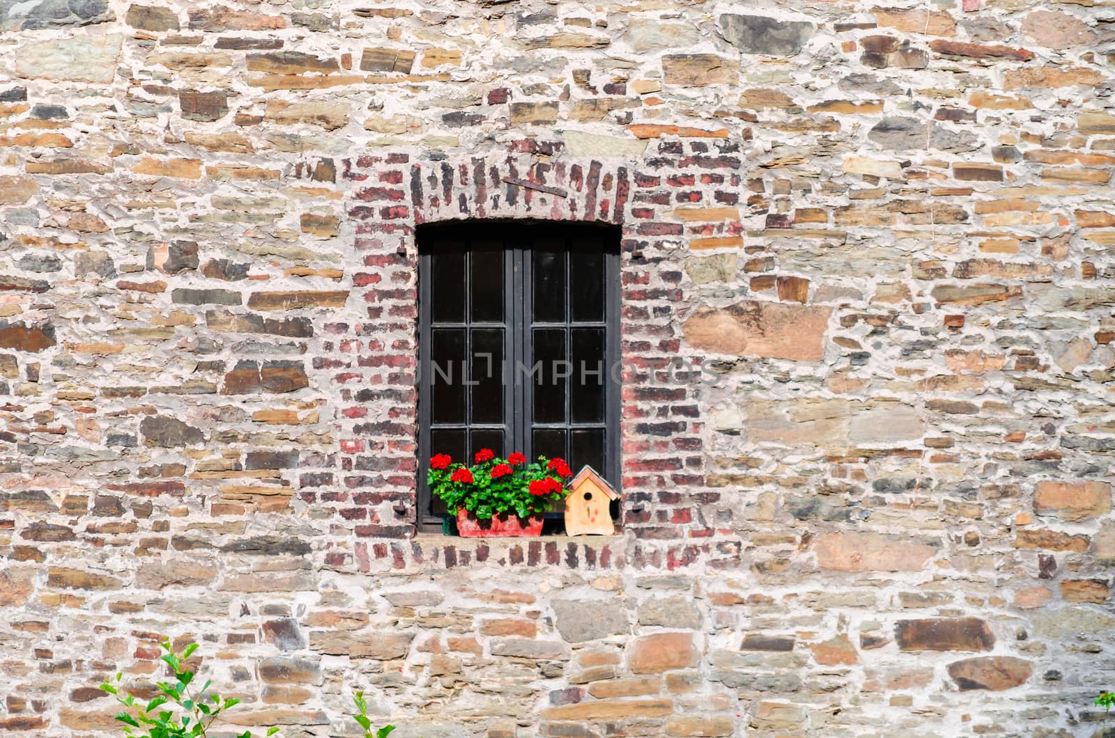 Historic window of a castle with stained glass