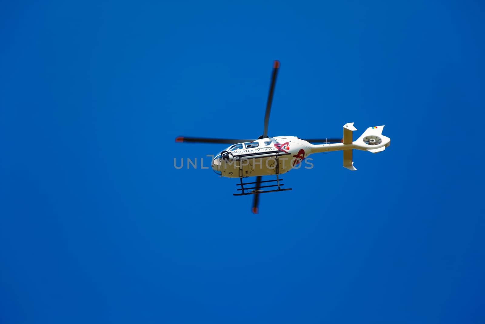 Brasov, Romania - August 12, 2010: TV news helicopter on a blue sky