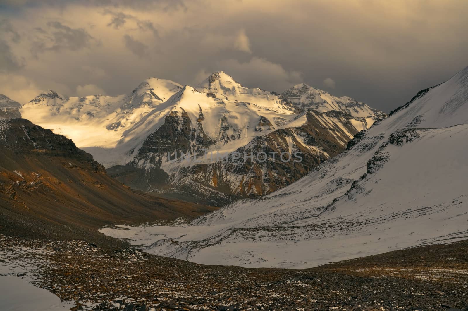 Scenic view of cloudy Wakhan valley in Tajikistan with snowy mountain peaks of Pamir and Karakoram
