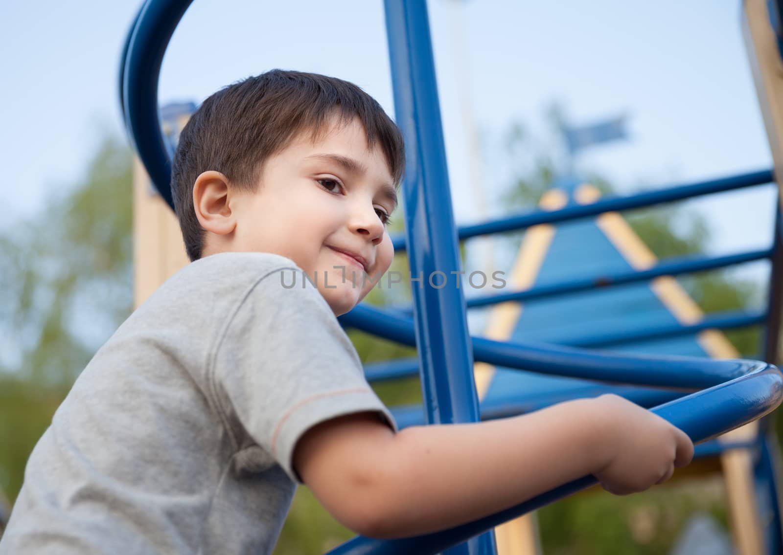 Portrait of a boy playing on the playground