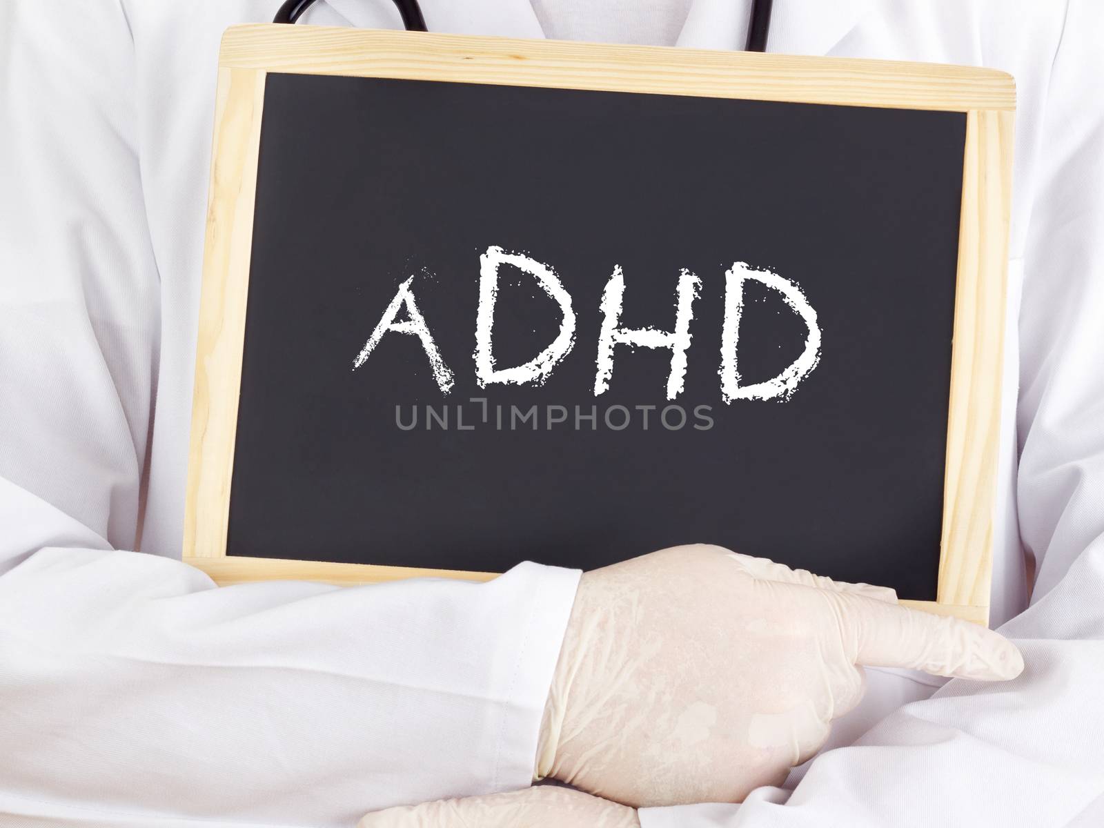 Doctor shows information on blackboard: adhd