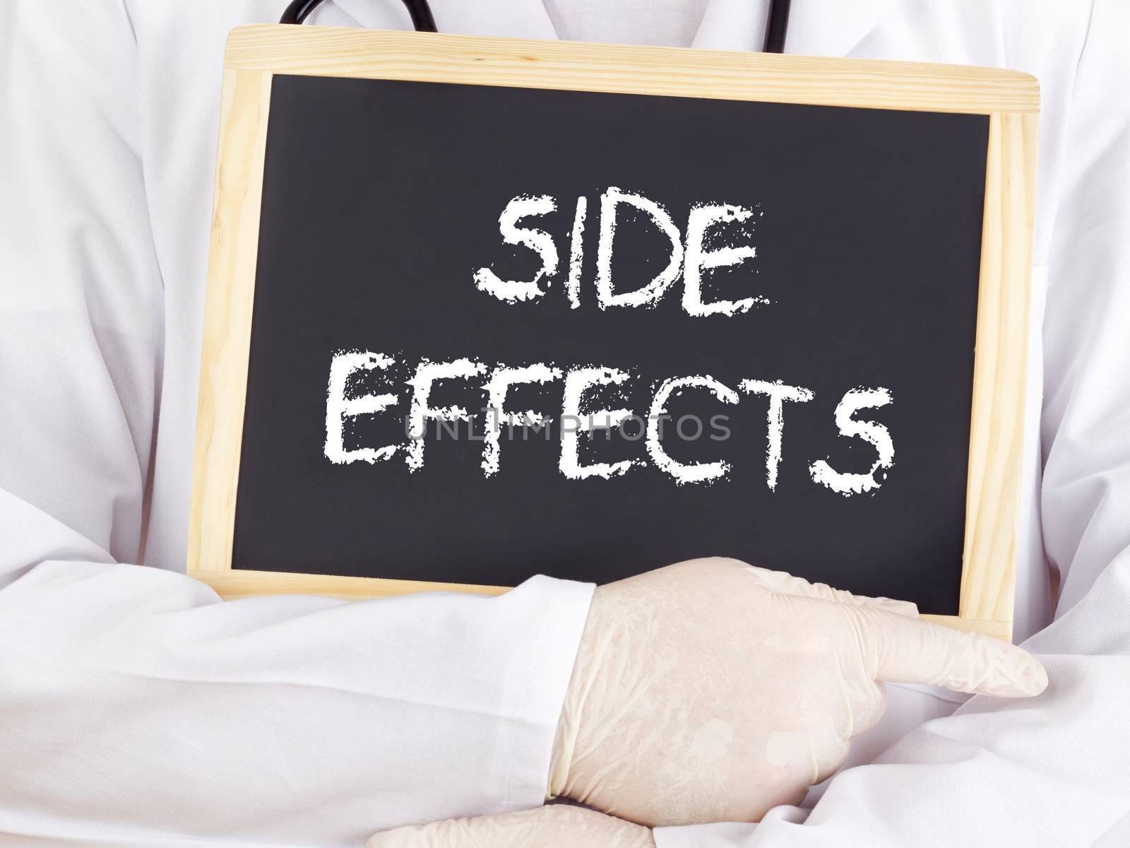 Doctor shows information on blackboard: side effects by gwolters