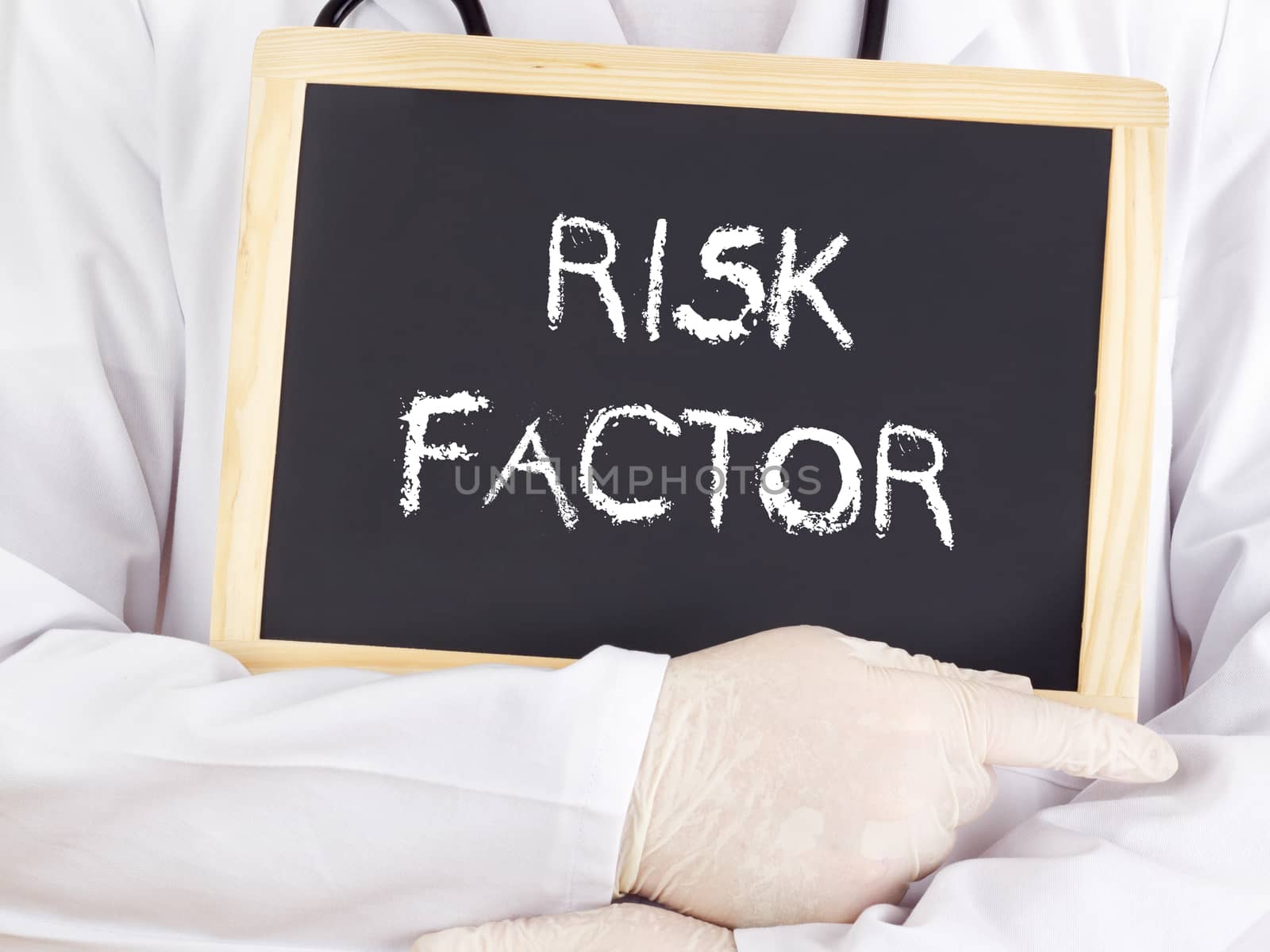 Doctor shows information on blackboard: risk factor by gwolters