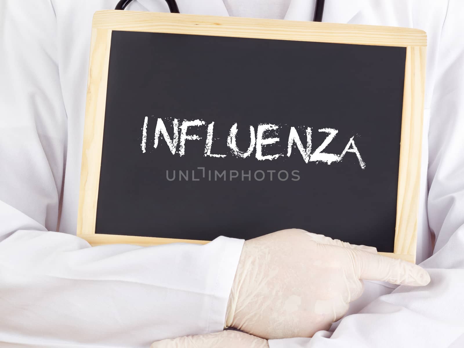 Doctor shows information on blackboard: influenza by gwolters