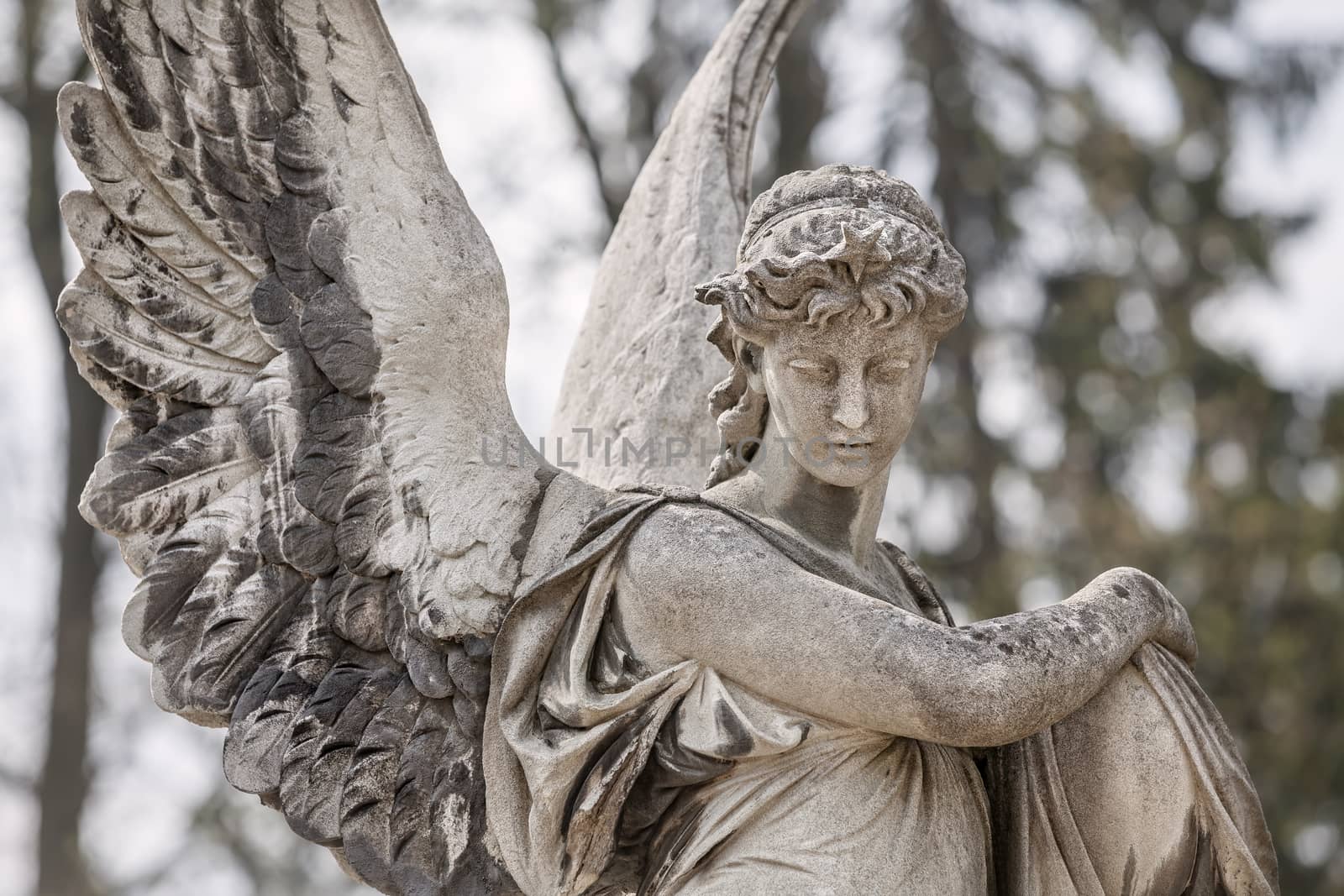 Old statue on grave in the Lychakivskyj cemetery of Lviv, Ukraine.