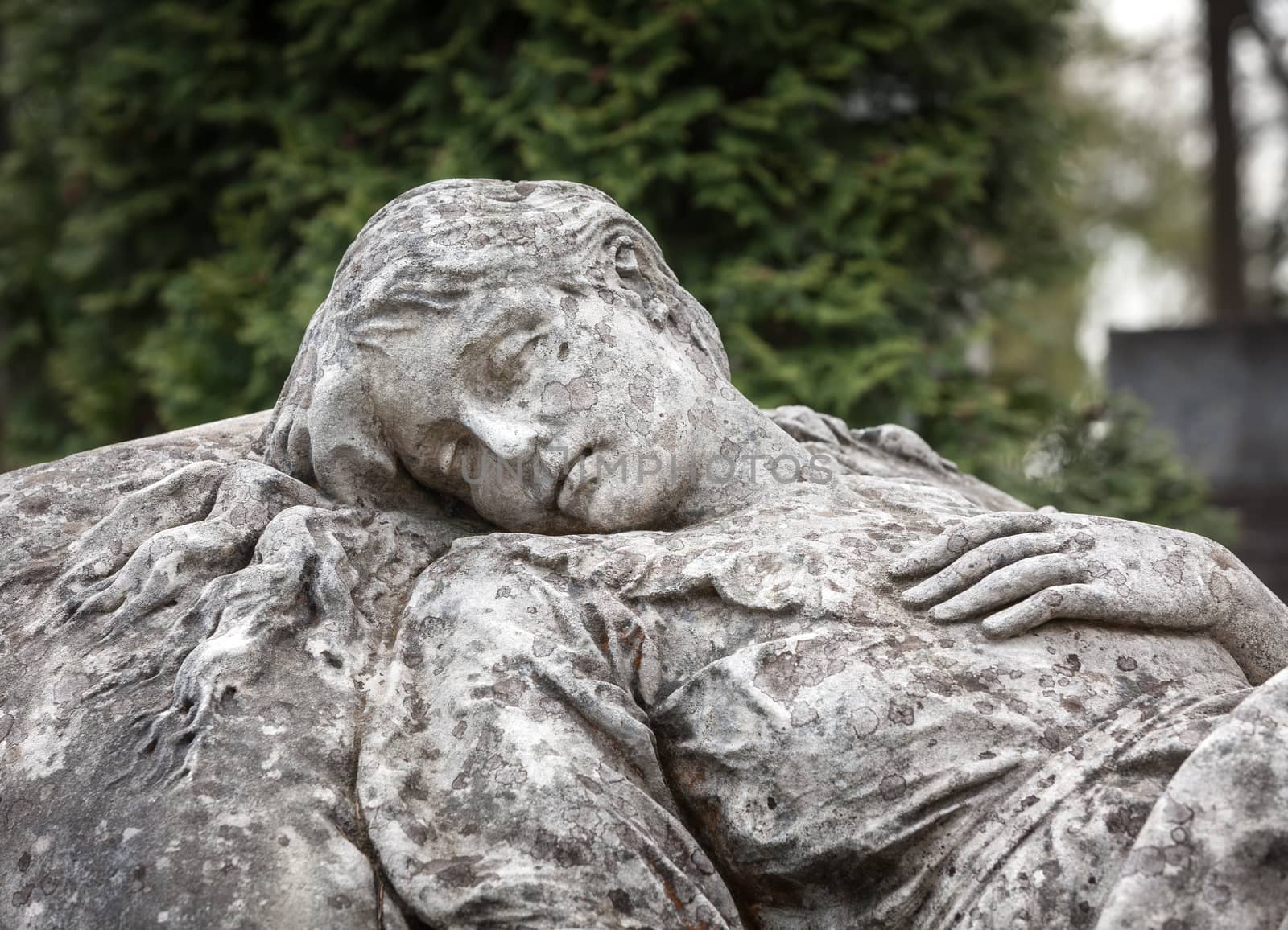 Old statue on grave in the Lychakivskyj cemetery of Lviv, Ukraine.