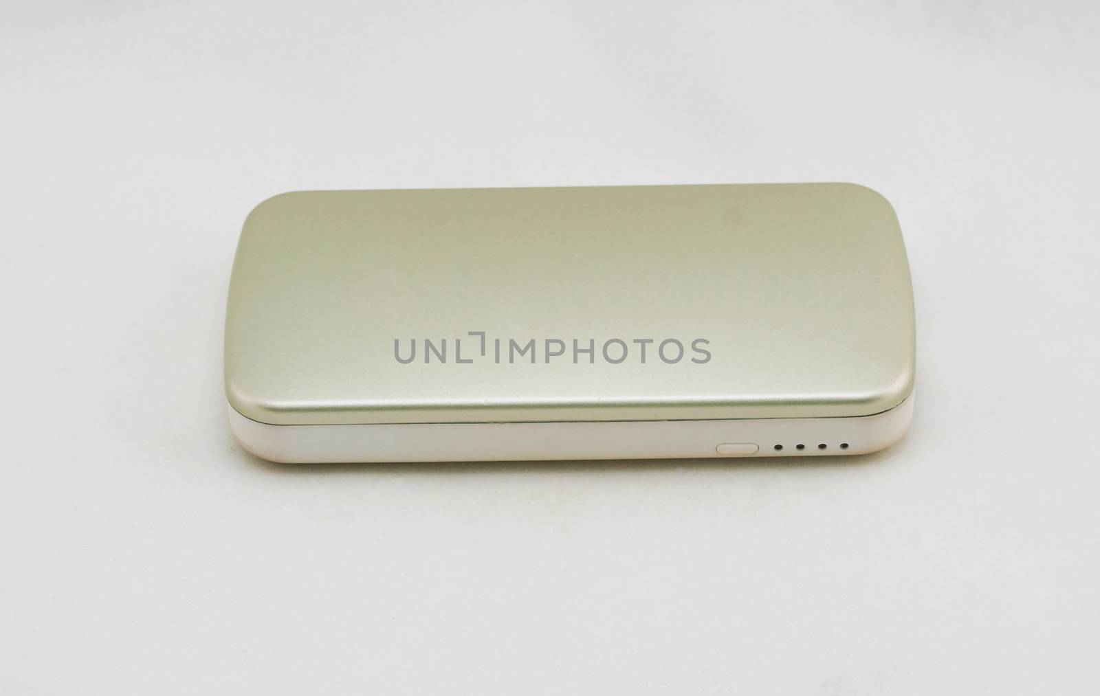 Gold optional external battery for an energy boost placed on a white background.                               