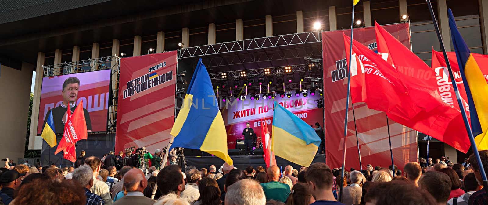 UZHGOROD, UKRAINE - MAY 1, 2014: Most rating Ukrainian presidential candidate Petro Poroshenko speaks at election meeting in Uzhgorod. On the poster: Live in new ways. Petro Poroshenko