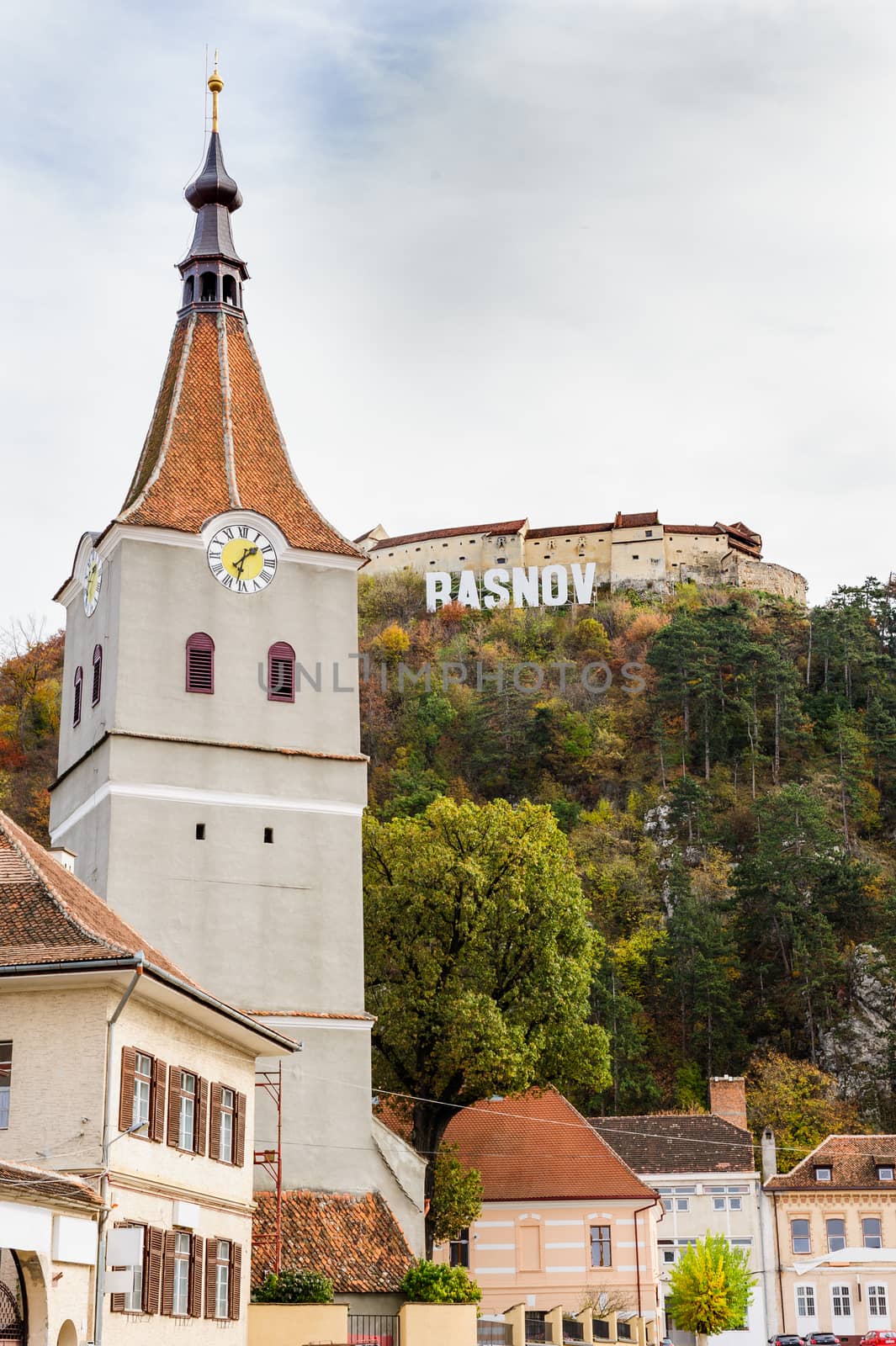 Evangelical protestant church of 14th century in Rasnov, Romania. Medieval saxon fortress at hill.