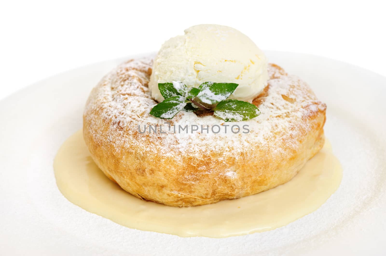 Ssavarin with ball of ice cream on top, selective focus