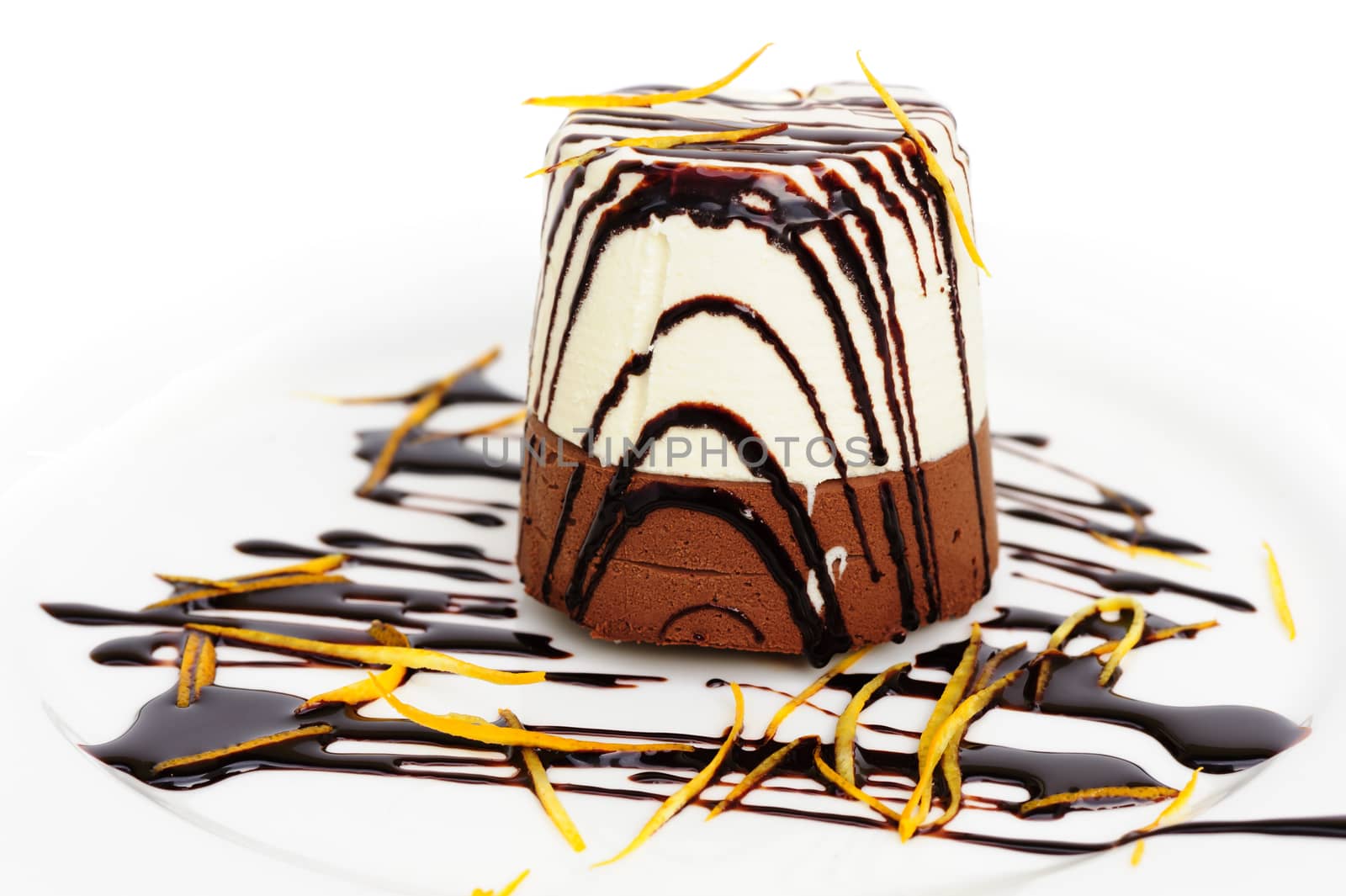 Chocolate and cream mousse on white plate