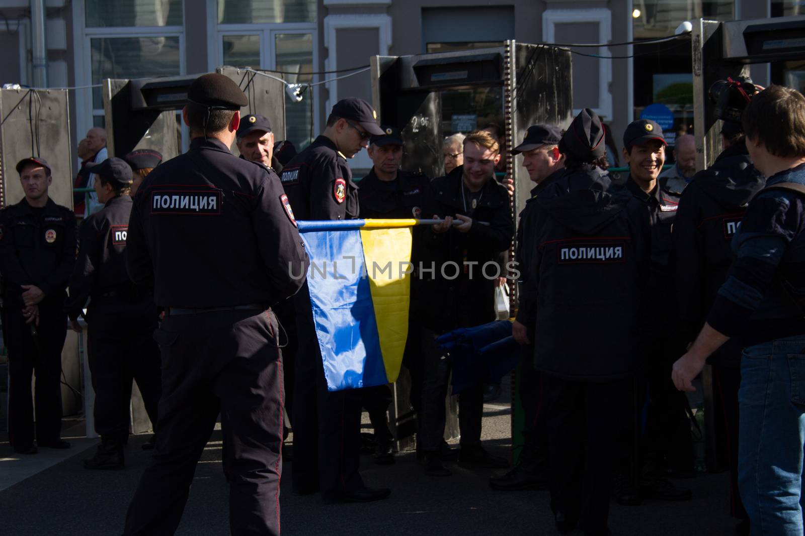 Moscow, Russia - September 21, 2014. Ukrainian flag checks the Russian police Peace March in Moscow against war with Ukraine