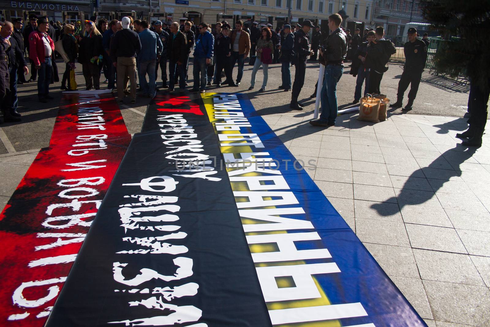 Moscow, Russia - September 21, 2014. Police chief Viktor Biryukov checks posters opposition peace March